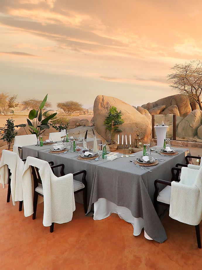 Dining setup at dusk overlooking the beautiful scenery of Al Ain Zoo