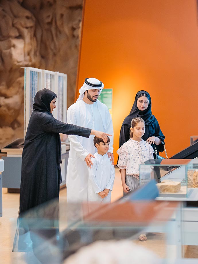 An Emirati family being assisted inside Sheikh Zayed Desert Learning Centre