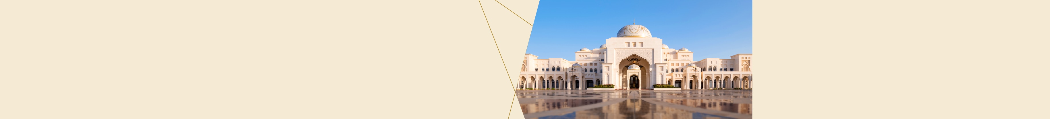 Ornate white palace reflected on a polished courtyard under a clear blue sky.