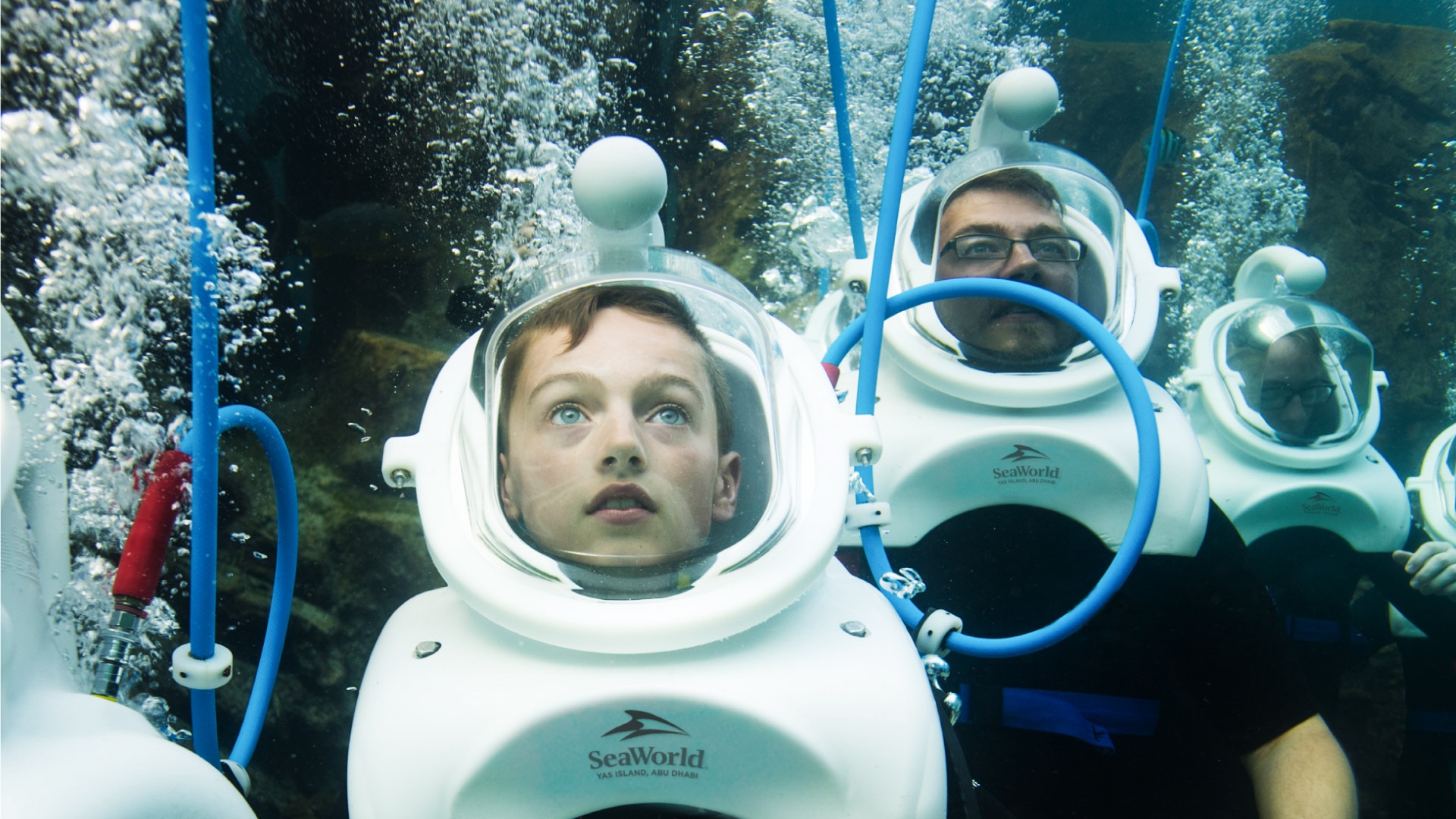 Family having fun underwater with SeaVenture breathing apparatus 