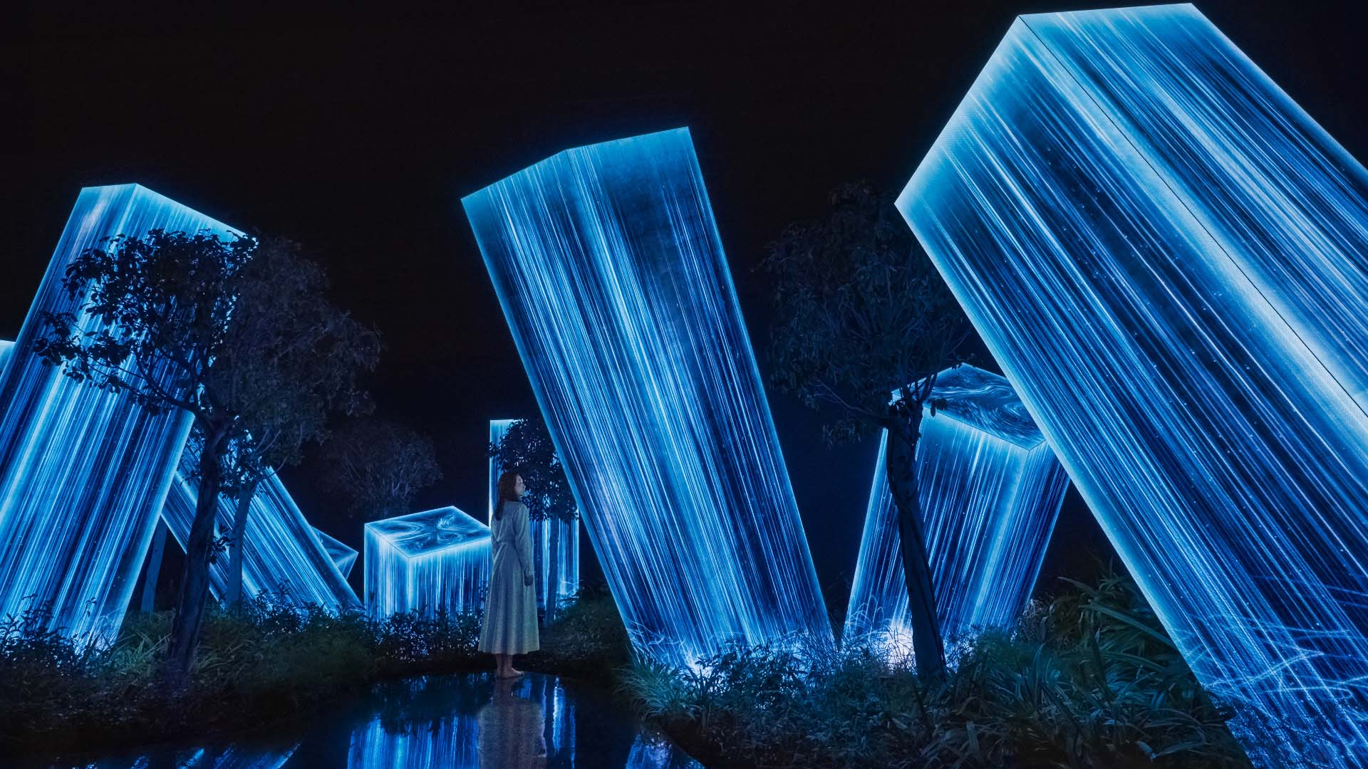 Woman staring at the blue box-like light form from Megalith in the Roots Garden artwork