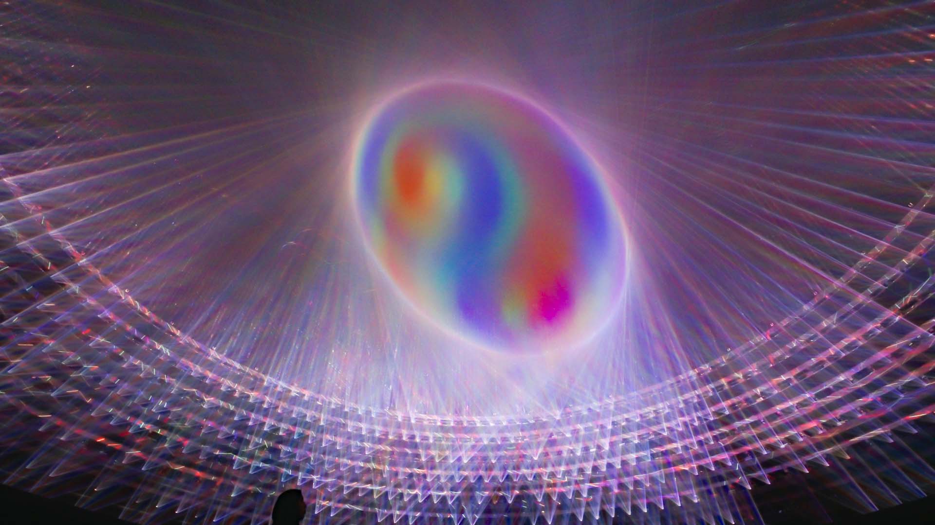 Purplish rainbow laser lights from Obverse and Reverse artwork