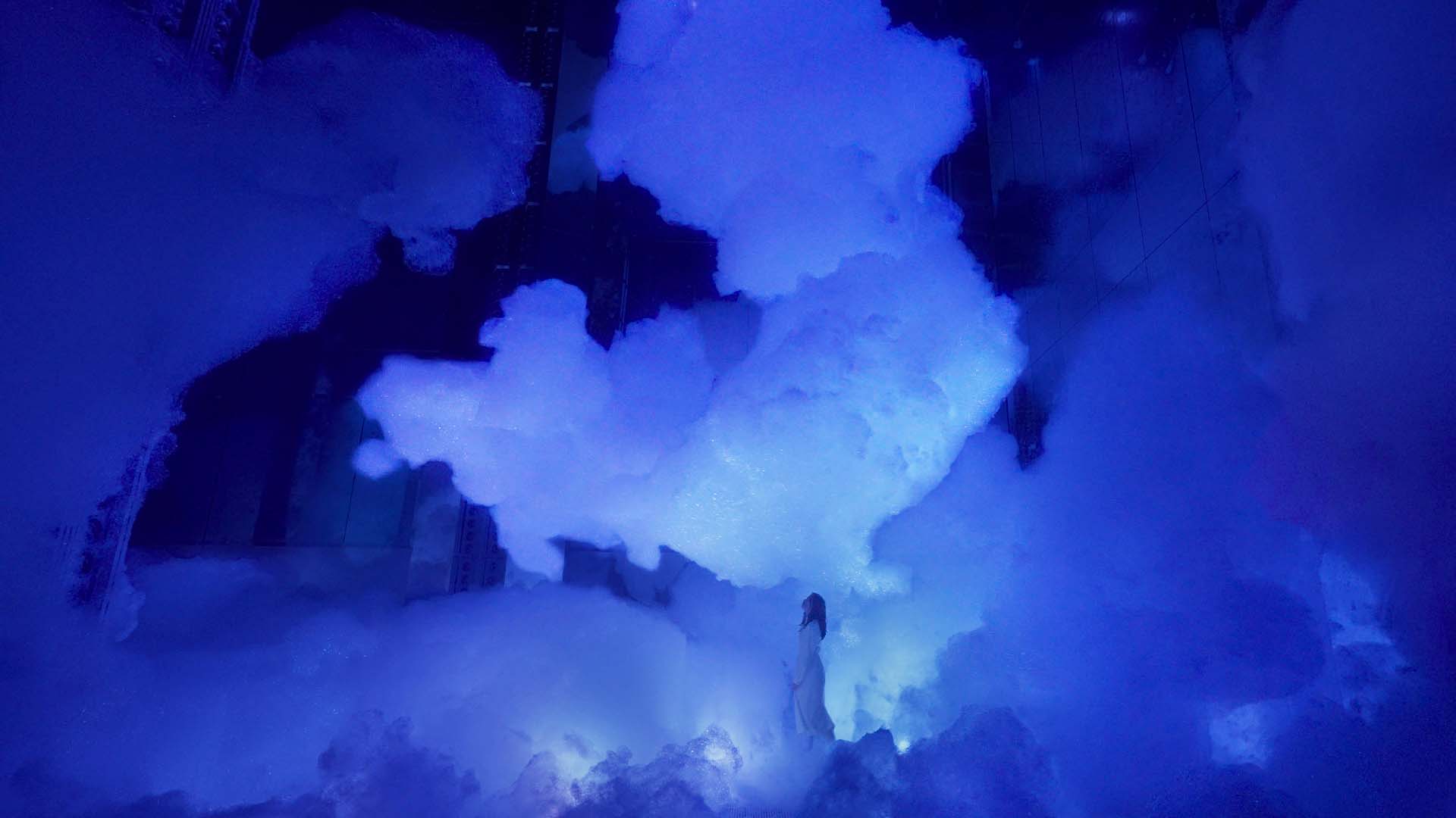 A lady surrounded by clouds inside Massless Amorphous Sculpture artwork