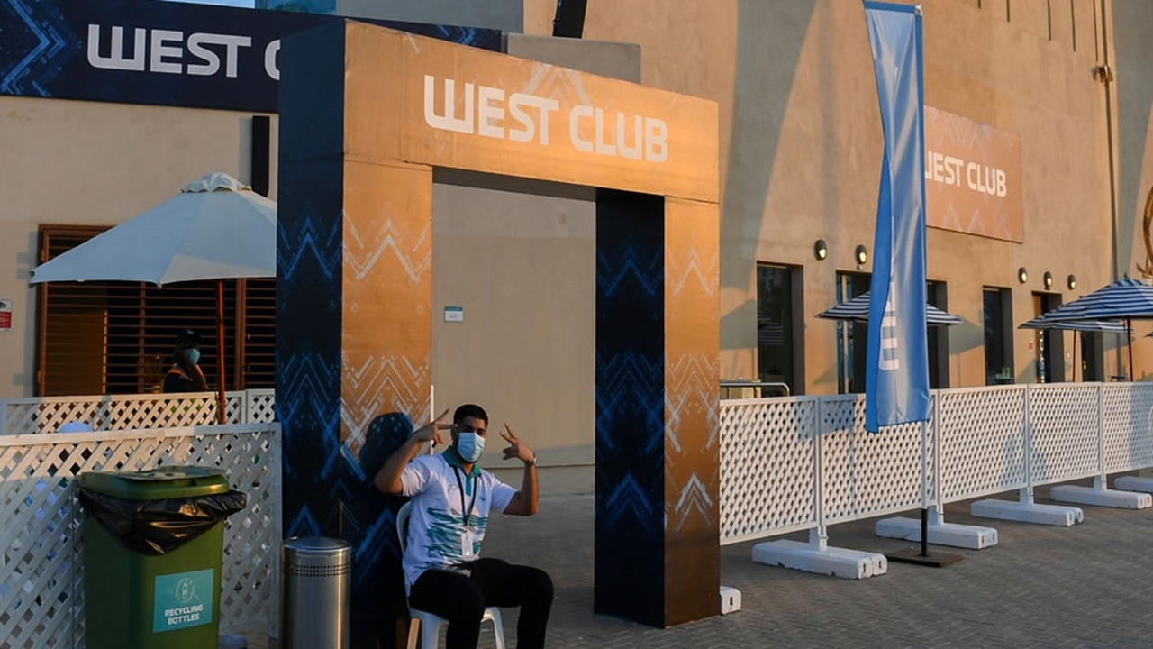 Empty West club with security guard before the gates open