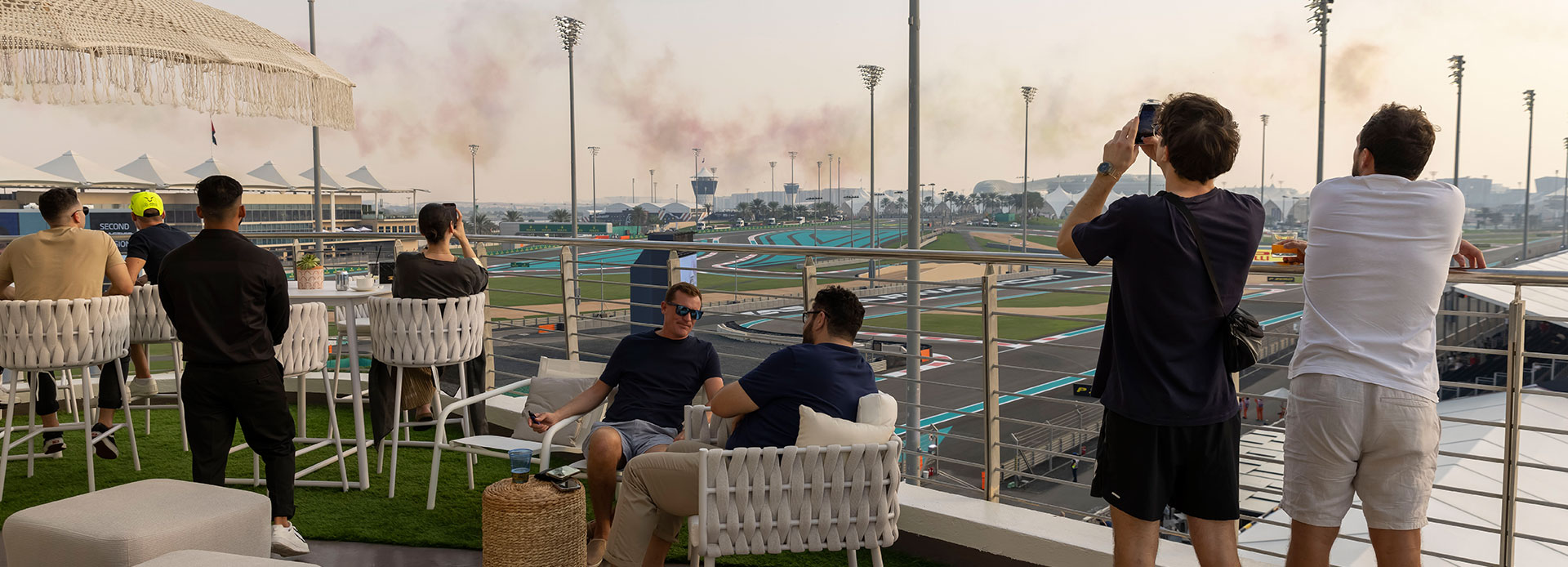 Guests watching the sunset from Shams Suite's terrace during the Abu Dhabi Grand Prix at Yas Marina Circuit.