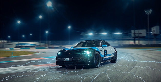 All-electric Porsche Taycan Turbo driving on the track at Yas Marina Circuit