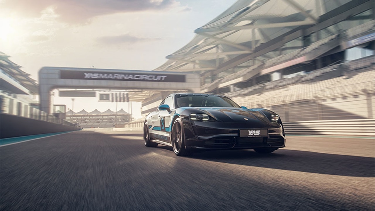 All-electric Porsche Taycan Turbo driving on the track at Yas Marina Circuit